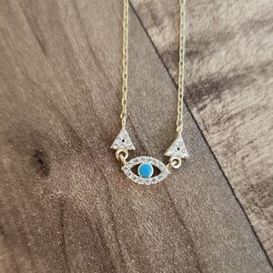 Gold Eye Necklace with Blue Accent